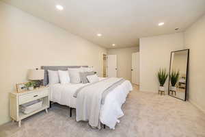 Bedroom featuring recessed lighting, baseboards, and light colored carpet