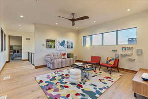 Living room with recessed lighting, visible vents, hardwood / wood-style flooring, and a ceiling fan