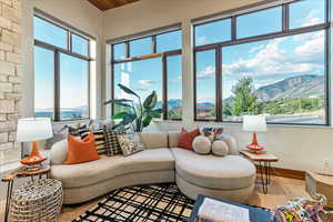 Sunroom featuring a mountain view