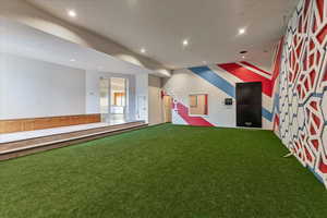 Interior space with recessed lighting and carpet floors