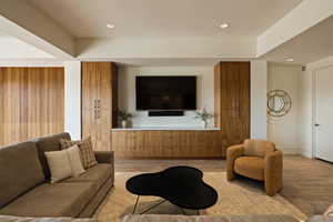 Living area featuring light wood-style flooring and recessed lighting