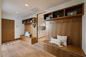 Mudroom featuring light wood-style floors and recessed lighting