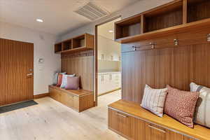 Mudroom with light wood-style floors, recessed lighting, visible vents, and baseboards