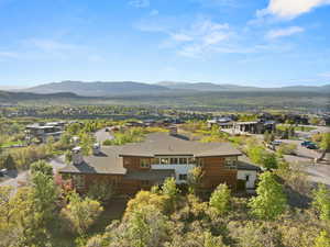 View from above of property with a mountain backdrop