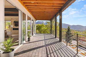 Wooden deck featuring a mountain view