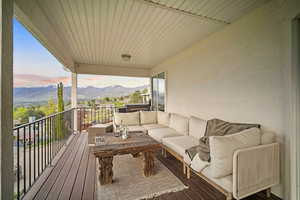 Balcony with outdoor lounge area and a mountain and valley views