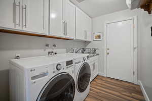 Laundry room with tile flooring and sink, with plenty of storage space
