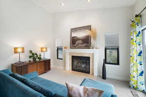 Living Room with gas fireplace  opens out to a balcony with beautiful views