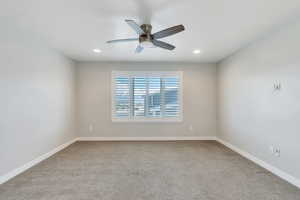 Empty room featuring carpet floors, recessed lighting, and ceiling fan