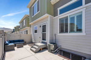 View of patio / terrace with an outdoor hangout area, fence, and cooling unit