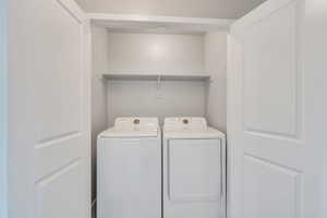Laundry area featuring laundry area and washing machine and clothes dryer