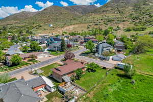 Birds eye view of property with a residential view and a mountain view