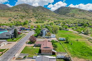 Aerial view featuring a residential view and a mountain view
