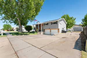 Raised ranch featuring brick siding and RV parking