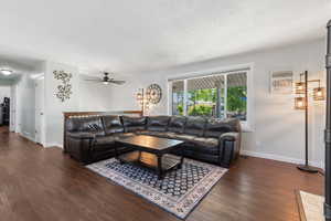 Living area featuring dark wood finished floors