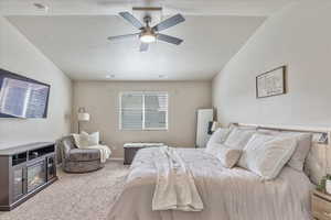 Carpeted bedroom featuring baseboards, a textured ceiling, and ceiling fan