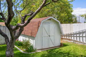 View of shed featuring a fenced backyard