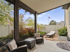 View of patio with a fenced backyard