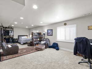 Bedroom with visible vents, baseboards, carpet flooring, and recessed lighting