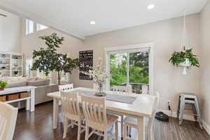 Dining space featuring baseboards, recessed lighting, and dark wood-style flooring