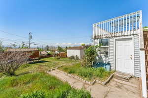 View of yard featuring fence