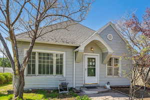 View of front of home featuring roof with shingles