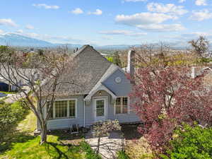 View of front of property featuring a shingled roof