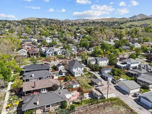 Birds eye view of property with a residential view and a mountain view
