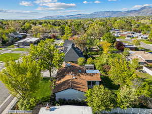 Birds eye view of property featuring a mountain view and a residential view