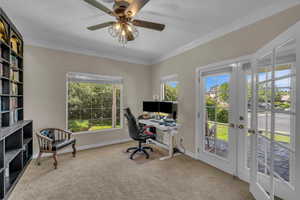 Office featuring crown molding, french doors, carpet, a ceiling fan, and baseboards