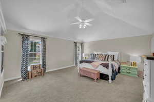 Bedroom with baseboards, ornamental molding, and carpet