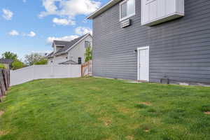 View of yard featuring fence