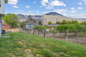 View of yard featuring fence private yard and a mountain view