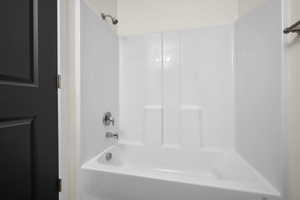 Full bath featuring tub / shower combination