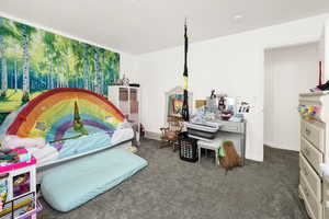 Bedroom with carpet floors and baseboards