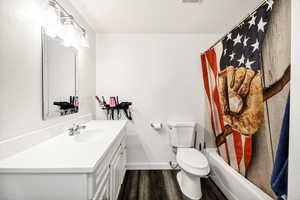 Full Bathroom with vanity, toilet,