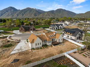 Birds eye view of property with a mountain view and a residential view