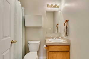Full bath with vanity and toilet