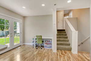 Office featuring french doors, visible vents, baseboards, light wood-style floors, and recessed lighting