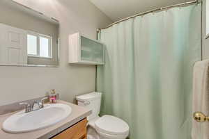 Bathroom with toilet and vanity