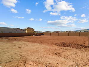 View of yard featuring fence