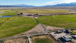 Aerial view of sparsely populated area featuring a water and mountain view
