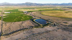 Aerial overview of property's location with rural landscape and a water and mountain view