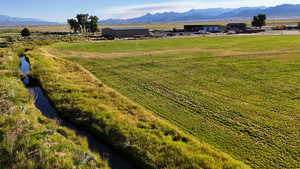Overview of rural landscape with a mountain backdrop