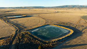 Birds eye view of property featuring a mountain view and a rural view