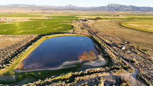 Aerial overview of property's location featuring a water and mountain view and rural landscape