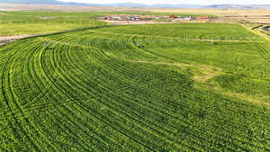 Aerial view of sparsely populated area with mountains and farmland