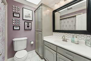 Full bathroom featuring visible vents, baseboards, vanity, toilet, and marble finish floor