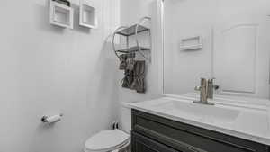 Bathroom with toilet and vanity