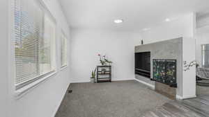 Interior space featuring recessed lighting, baseboards, visible vents, and wood finished floors